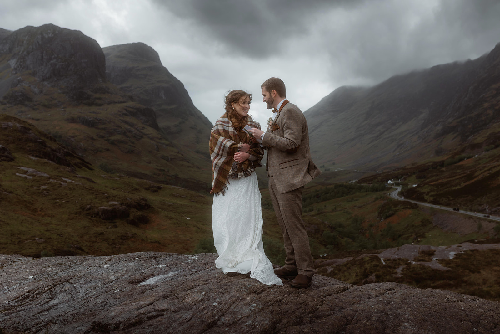 Holly and James share a romantic moment during their elopement ceremony at the majestic Glencoe, Isle of Skye