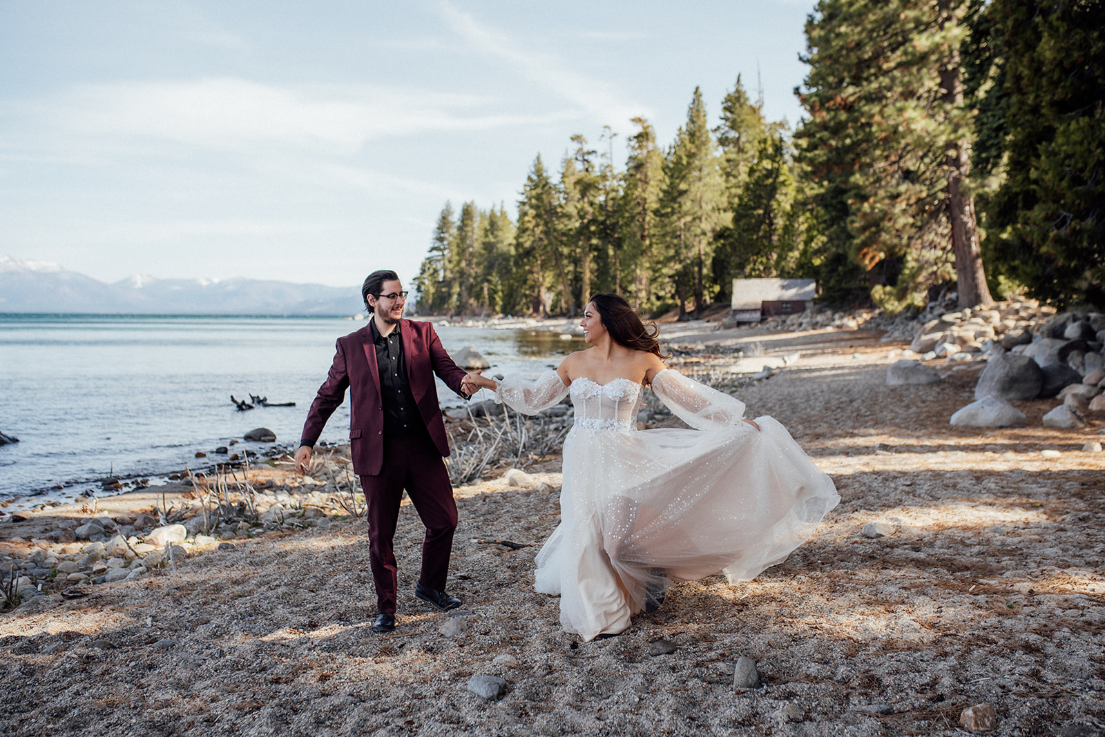 bride and groom dancing on the beach near Lake Tahoe