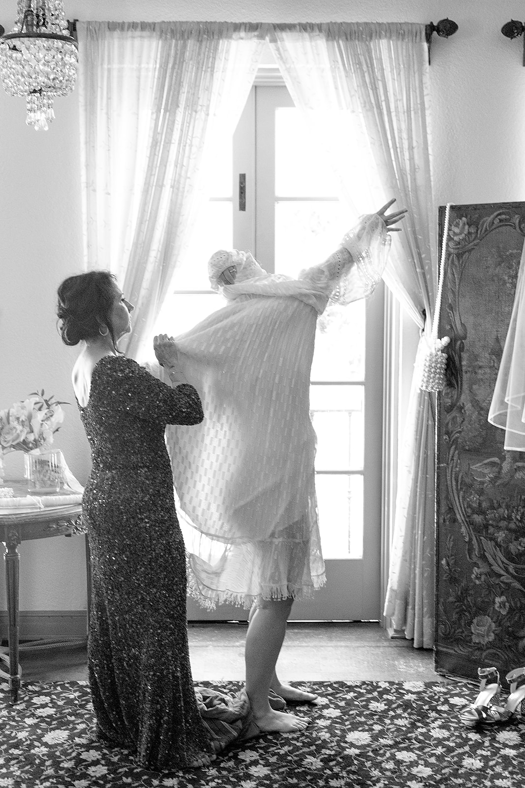 Pregnant bride and mom get dressed