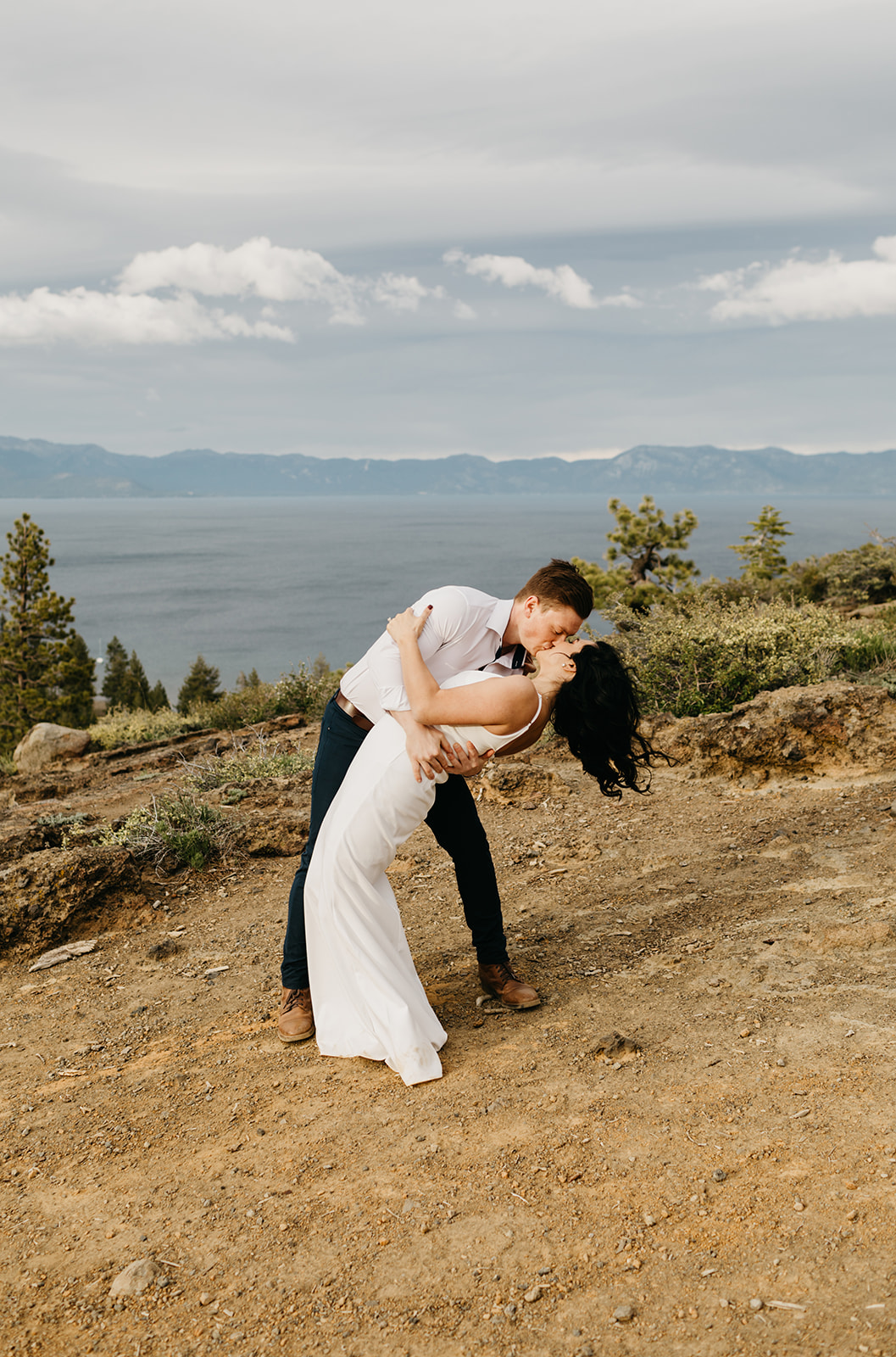 A couple shares a dip kiss in north lake tahoe