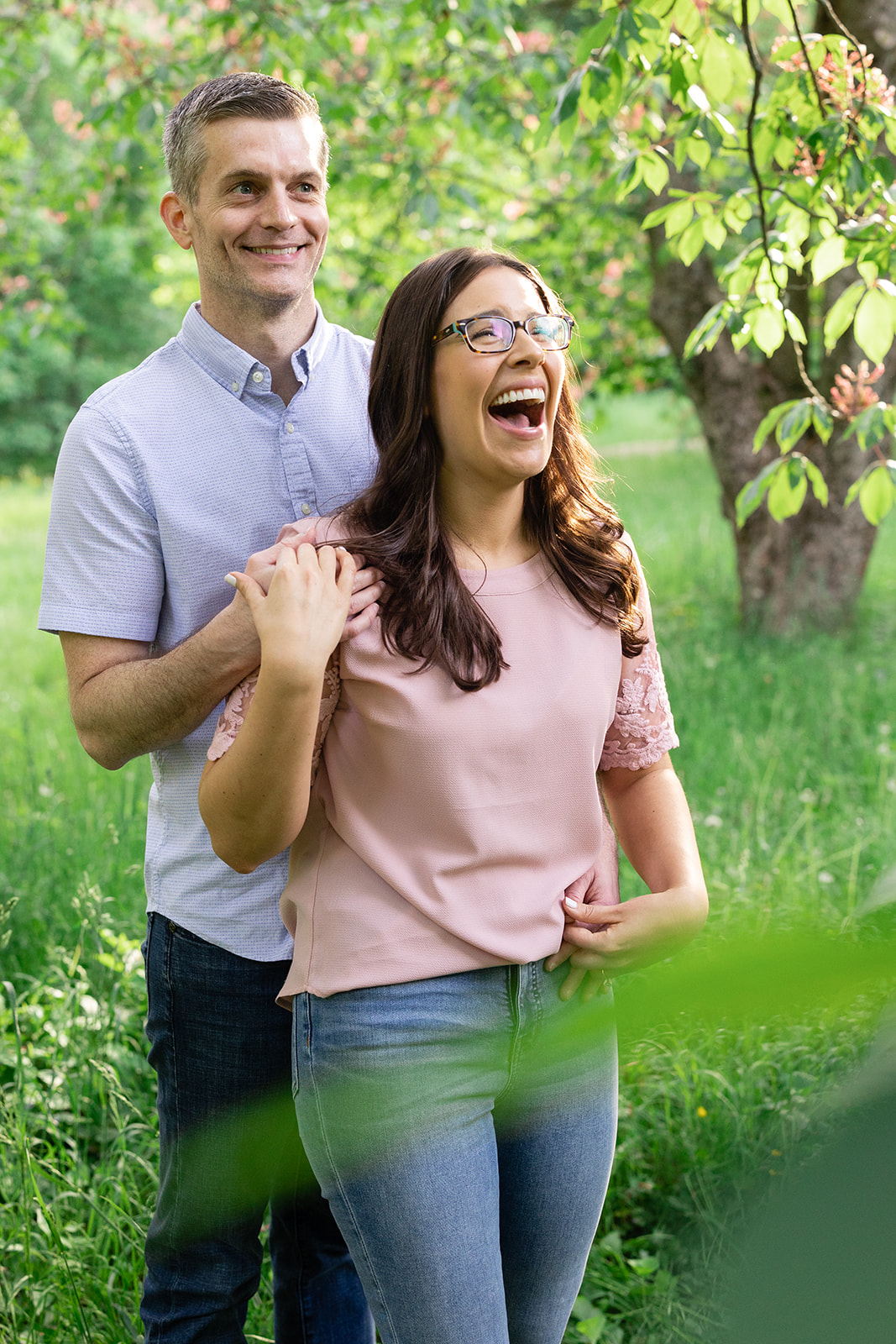 couple laughing during engagement session in Boston