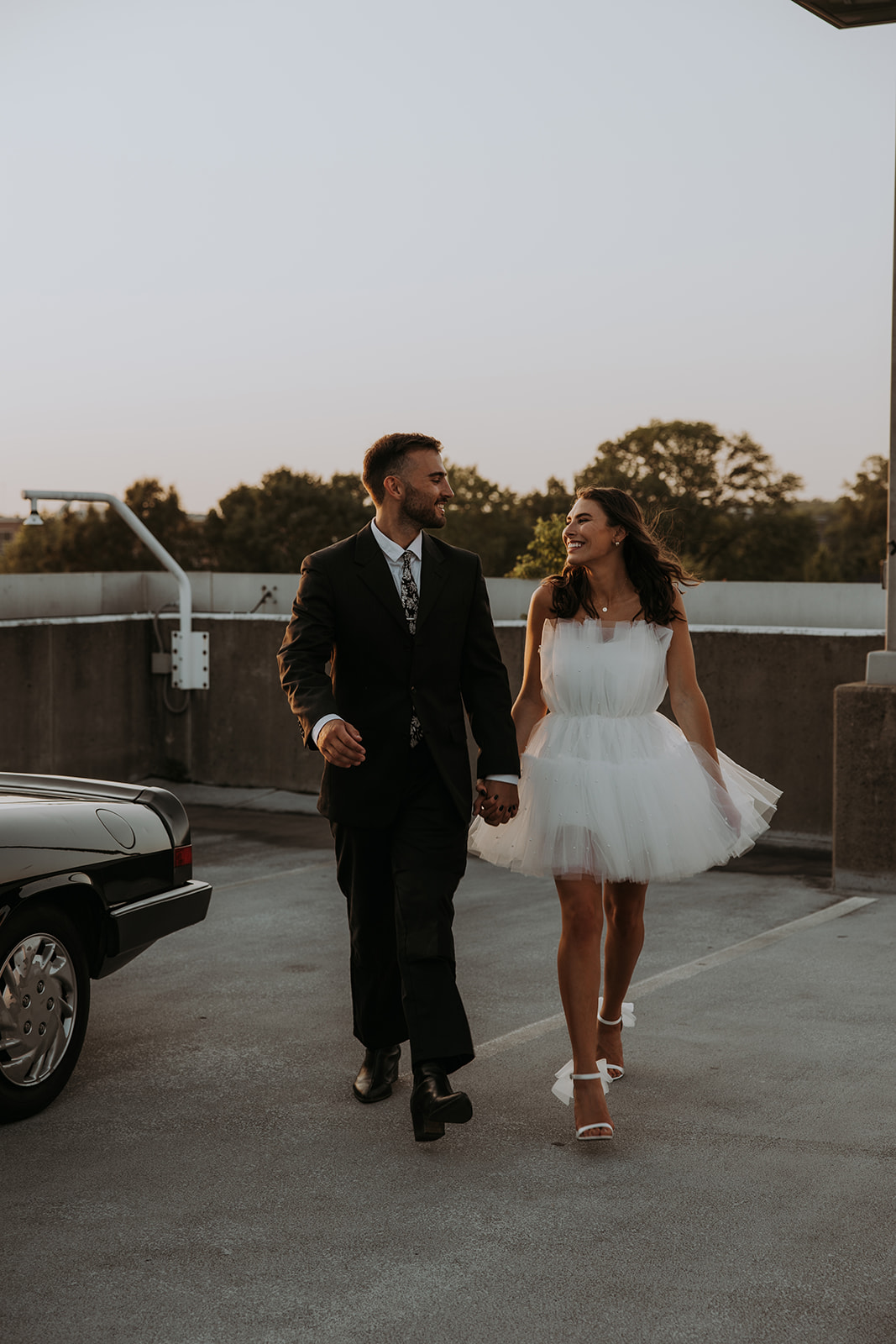 A parking garage rooftop engagement photo session
