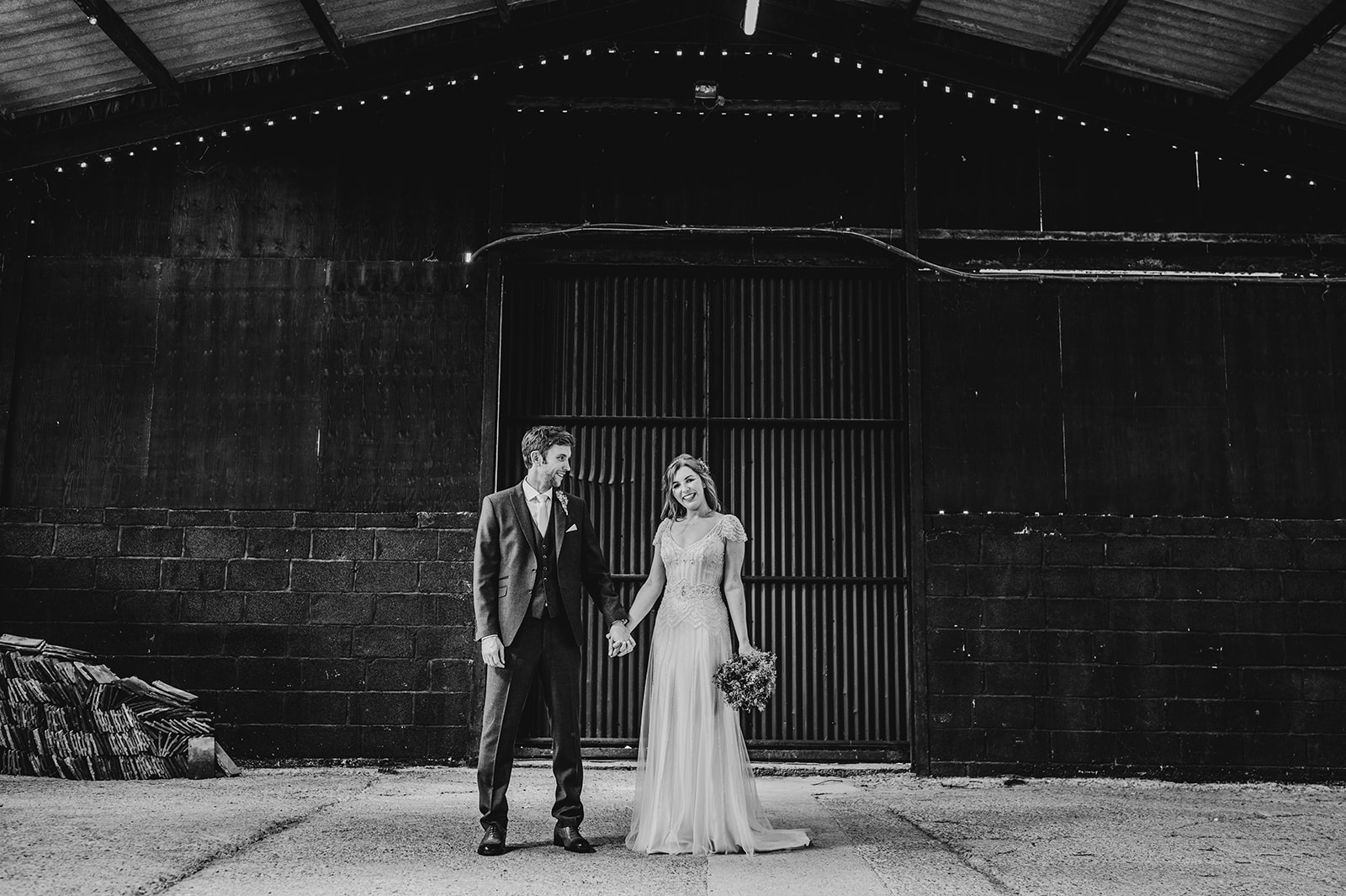 Wedding couple portrait in barn