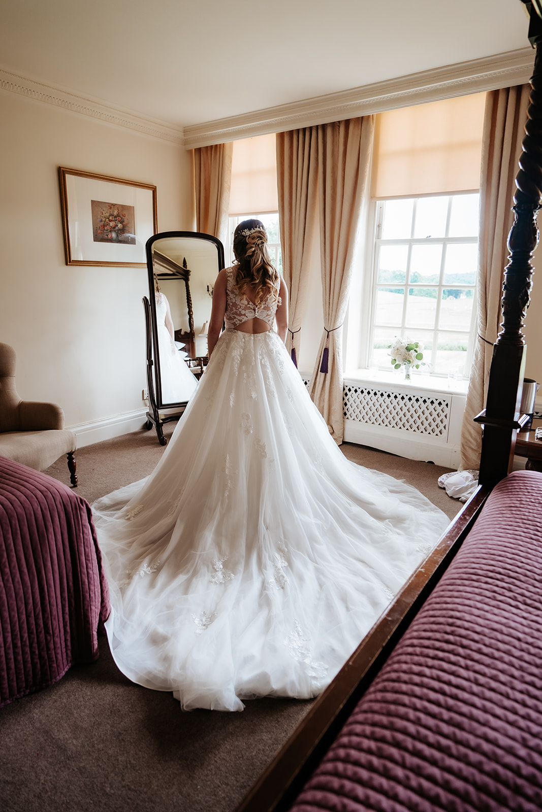 Beautiful bride with her wedding dress at parklands quendon hall