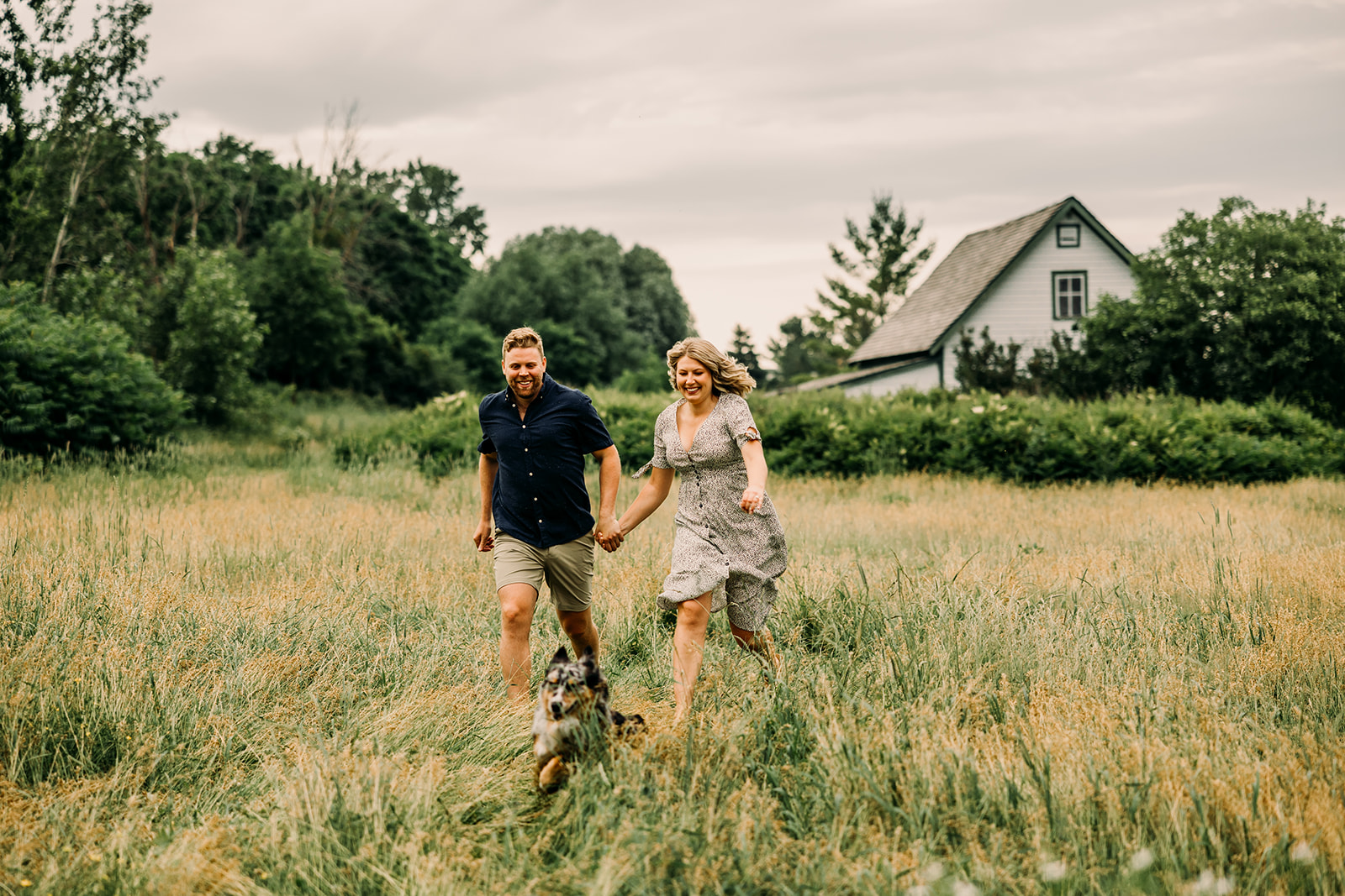 Romantic engagement photoshoot in a scenic field