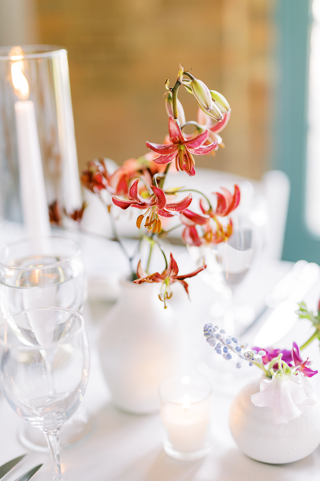 modern red lily in white vase for columbus park refectory wedding