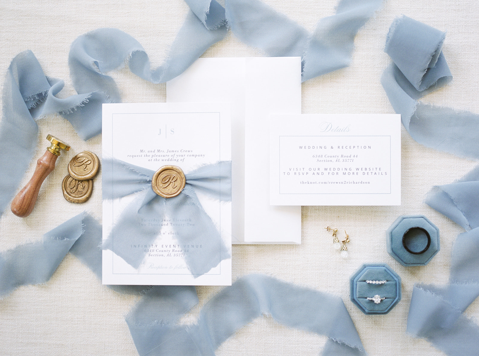 A film photo of a romantic wedding invitation suite for Infinity Event Venue