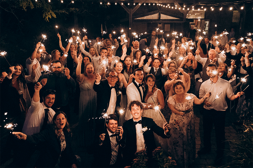 Wedding at the Mill Cobourg - all guests and bride and groom waiving lights for sparkler send off