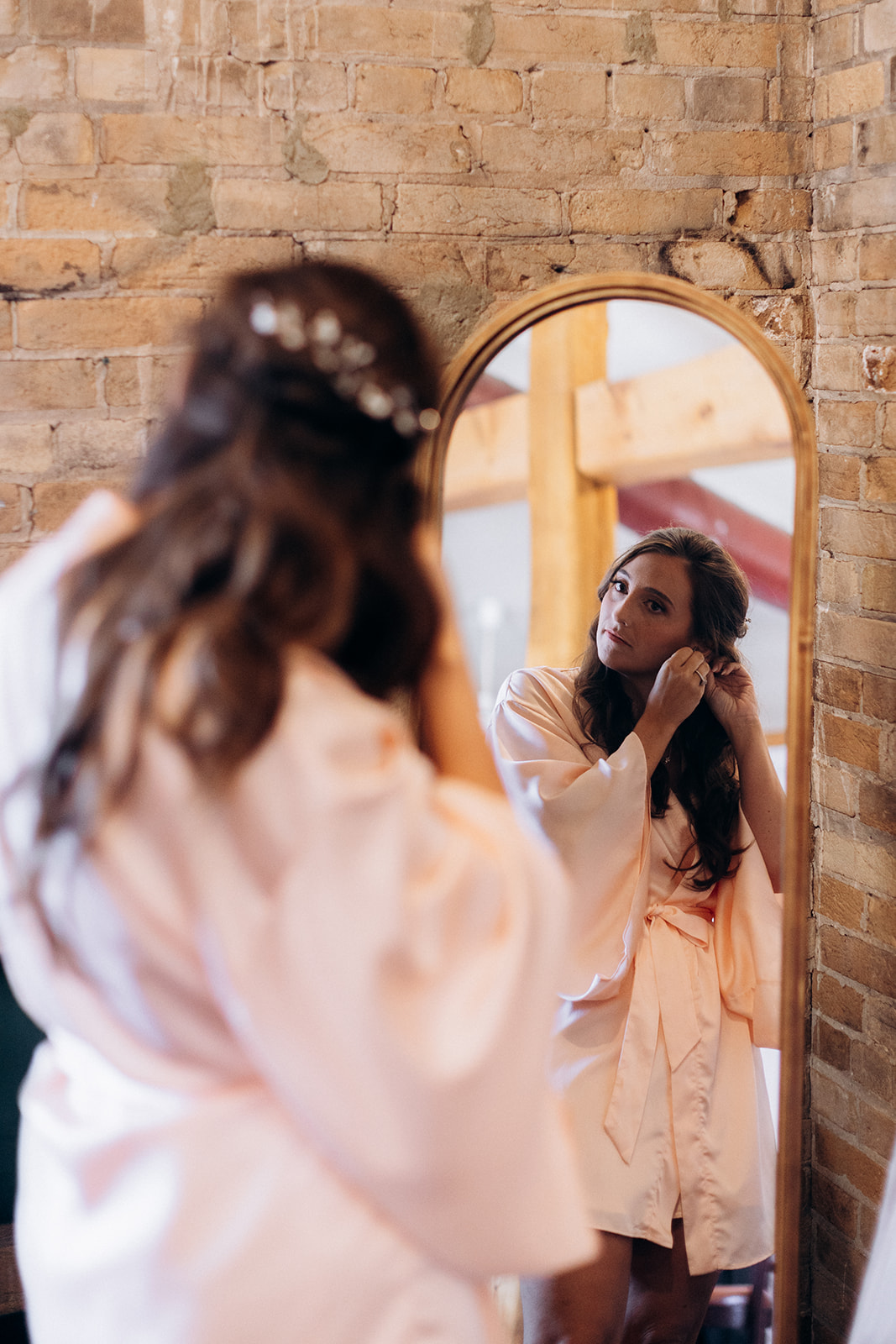 Wedding at the Mill Cobourg bride getting ready by a vintage mirror