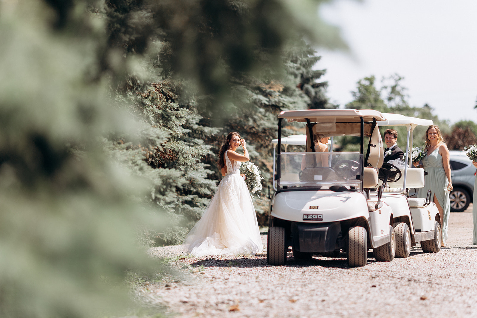Wedding at the Mill Cobourg bride next to golf carts
