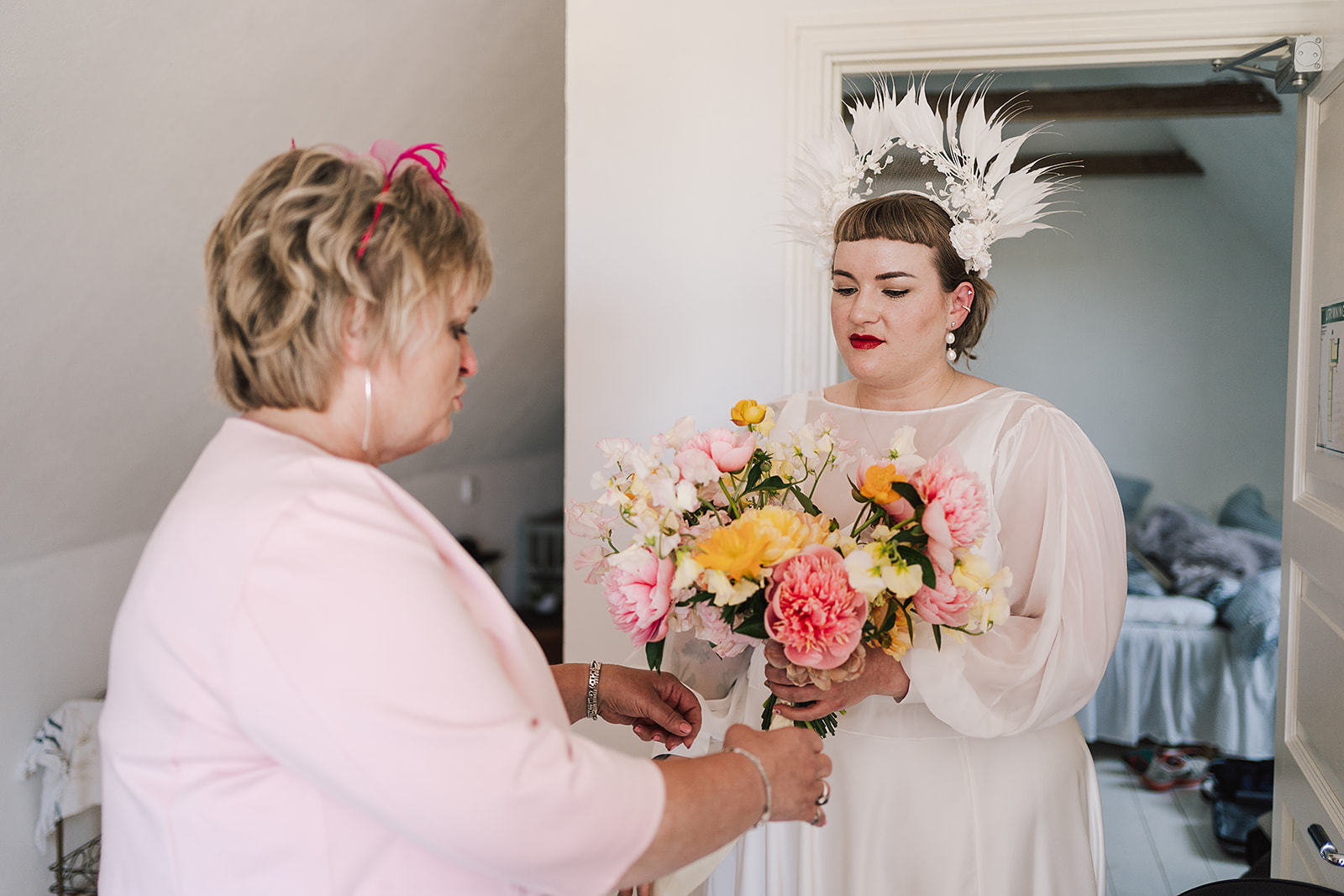 bride with mum moments before getting married
