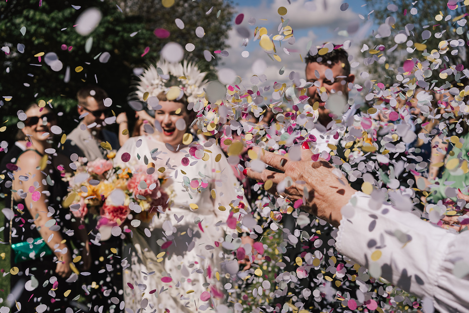 confetti shower over couple at Axatorpsgården Wedding 