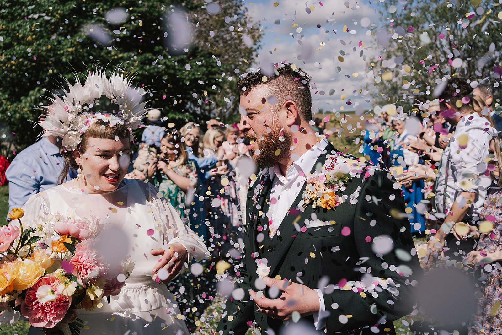confetti shower over couple at Axatorpsgården Wedding 