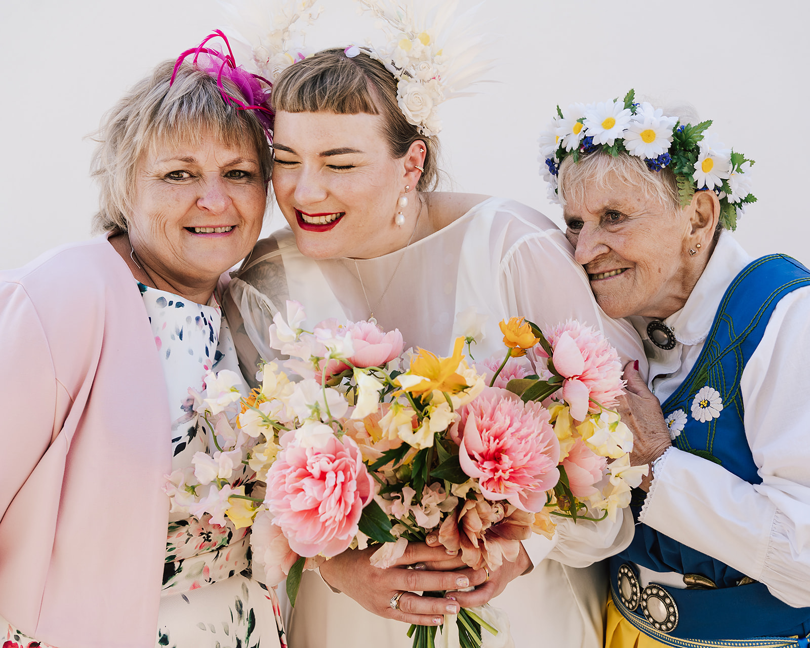 Bride hugged by mum and grandma