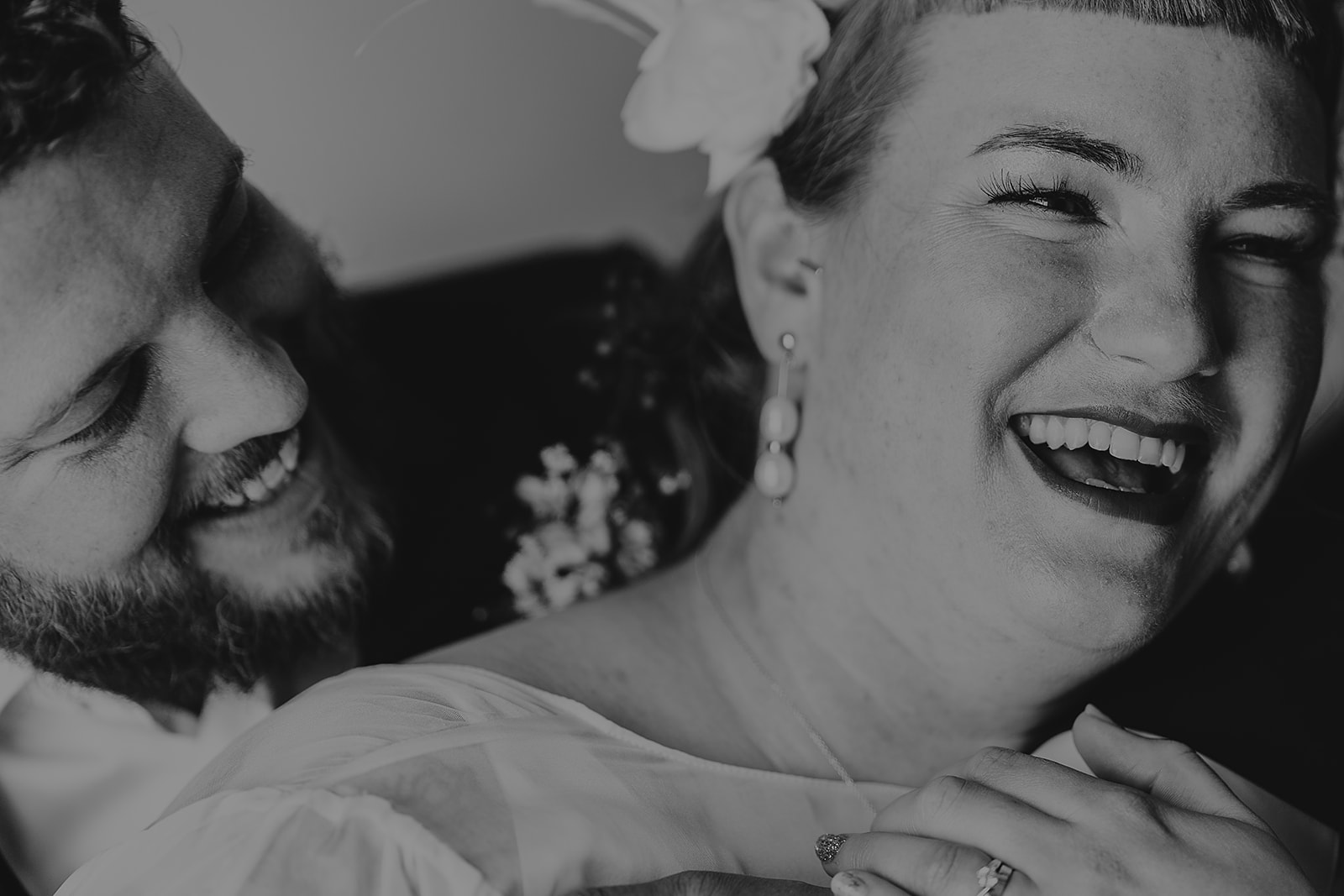 bride and groom laughing during couples portraits