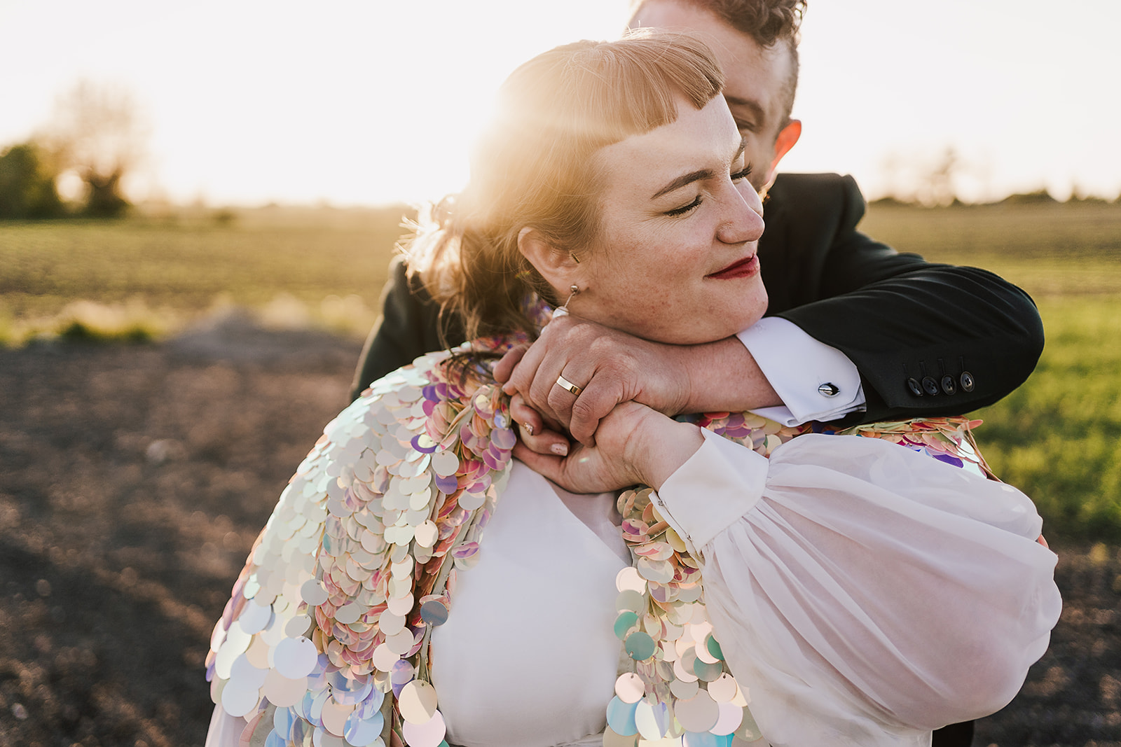 hug at sunset during couples portraits at Axatorpsgården Wedding 