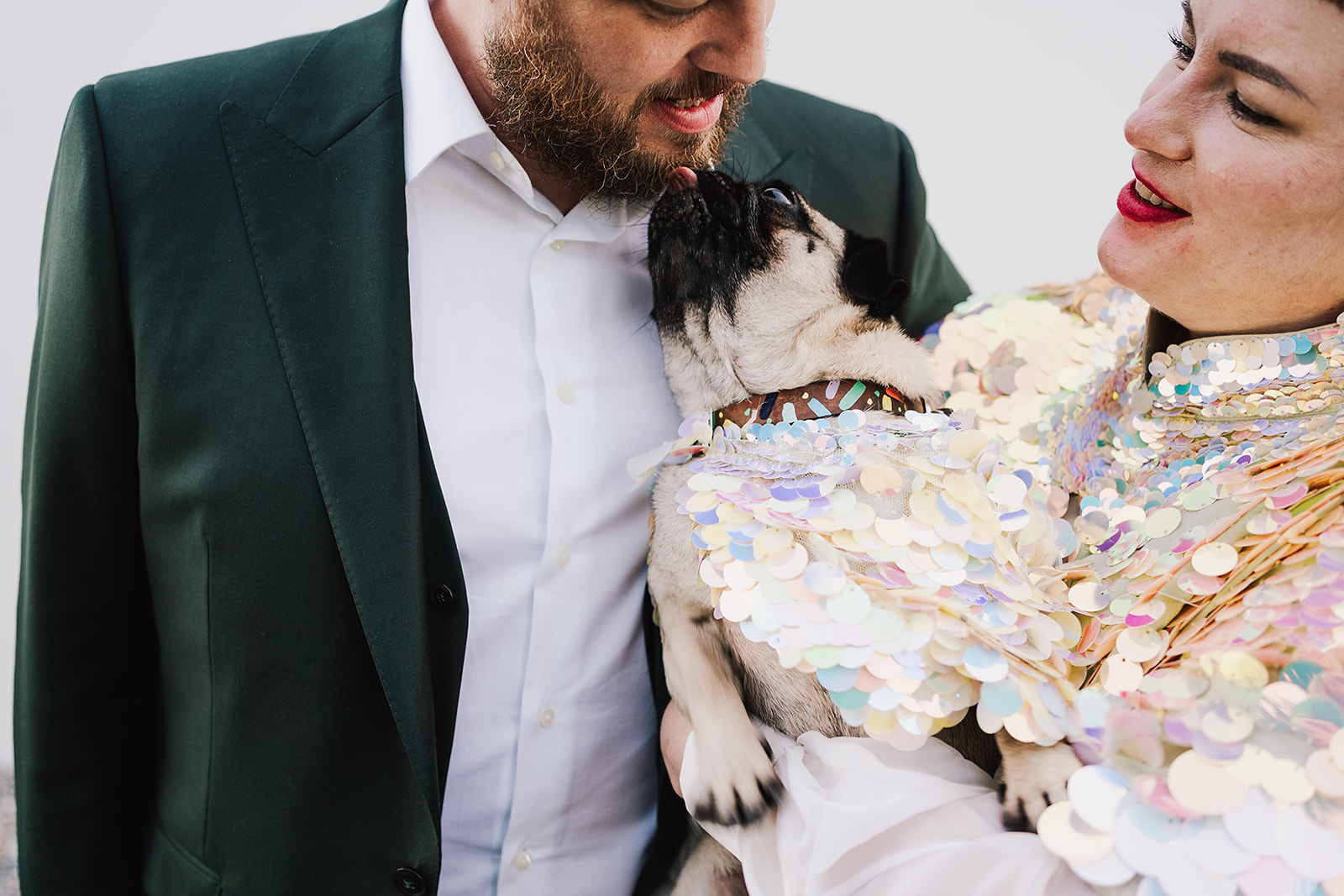 couples holding their dog at Axatorpsgården Wedding 