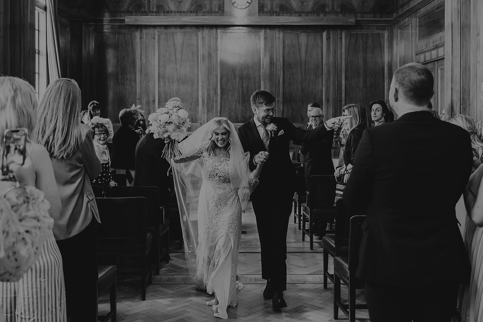 bride and groom exit wedding ceremony at Hackney Town Hall wedding ceremony