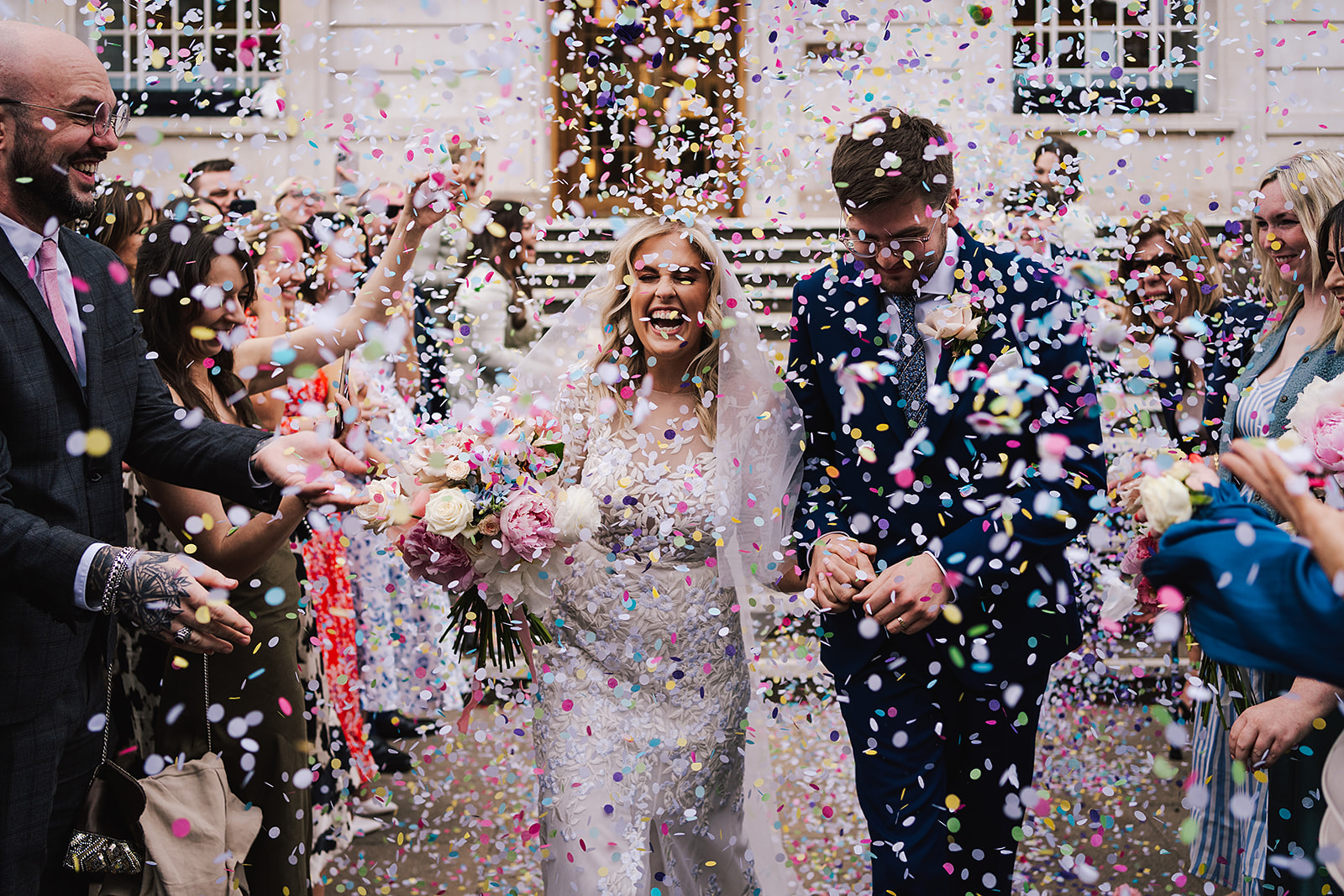 bride and groom in a shower of confetti at Hackney Town Hall wedding
