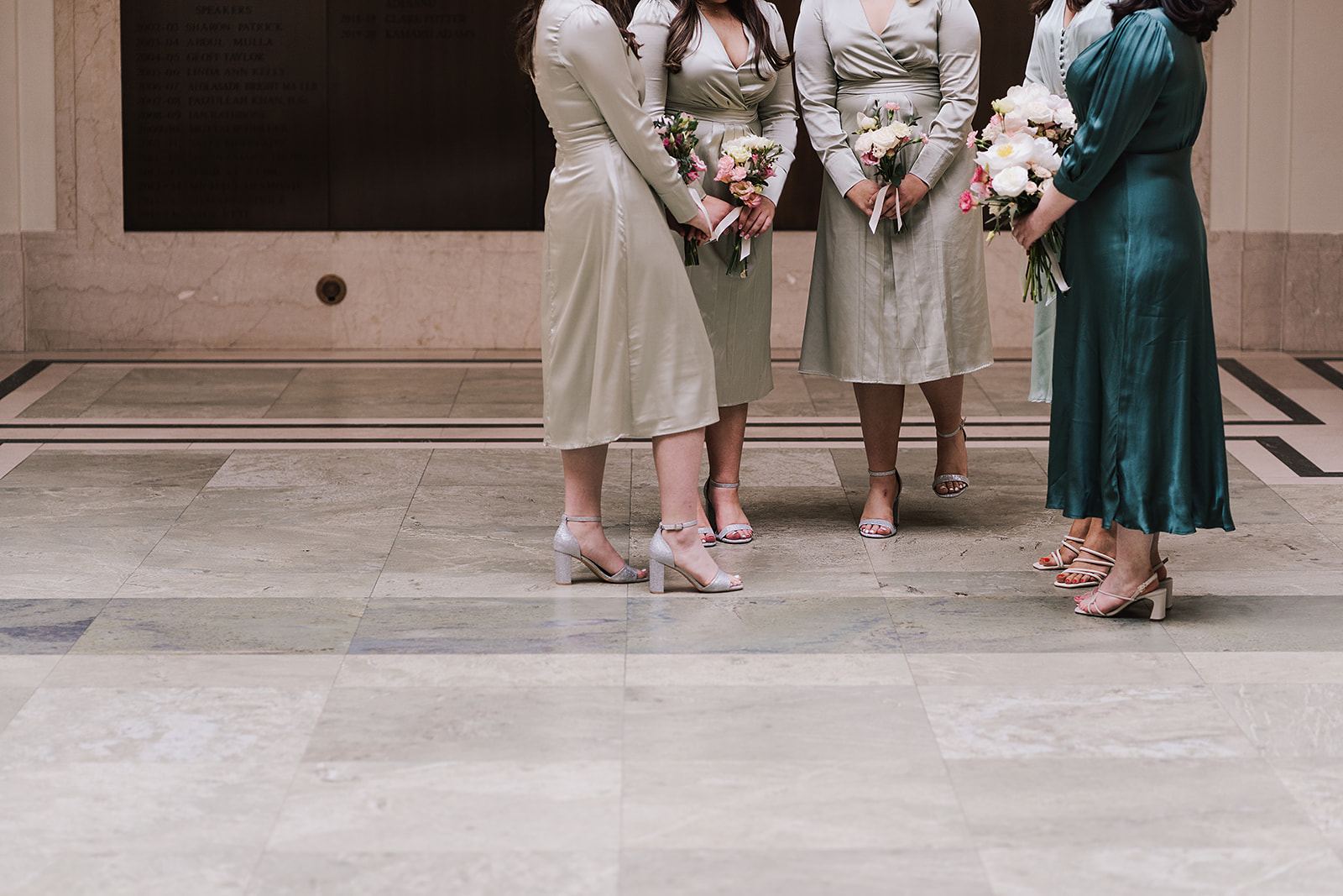 Bridesmaid waiting in foyer of Hackney Town Hall