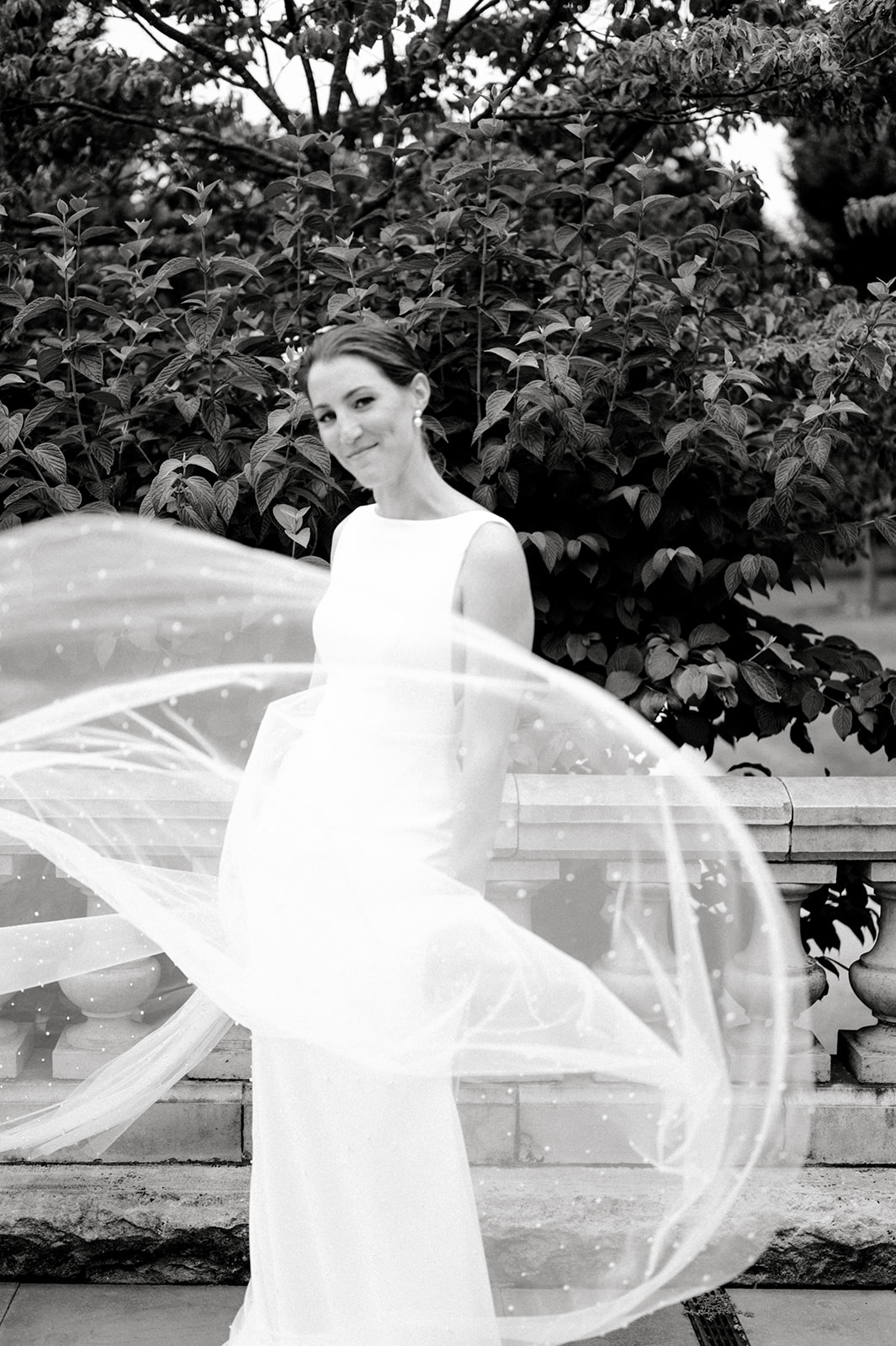 black and white bridal portrait toss veil