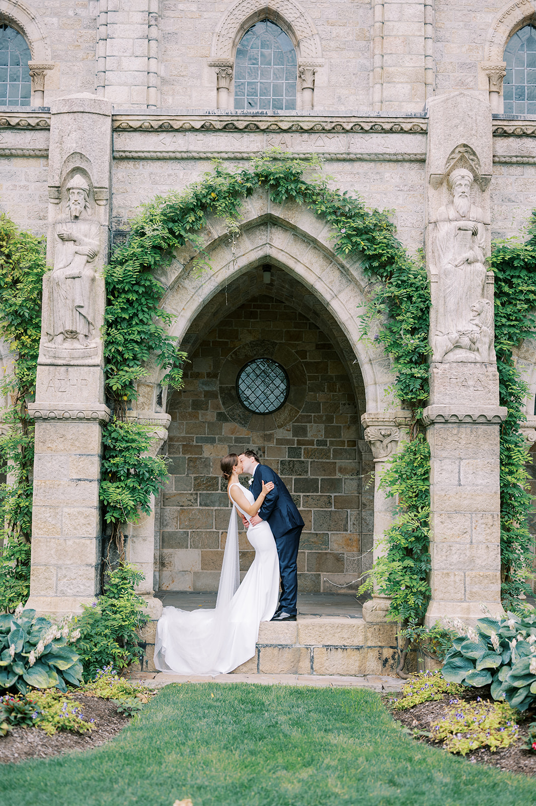 Bryn Athyn Cathedral archways wedding couple kissing 