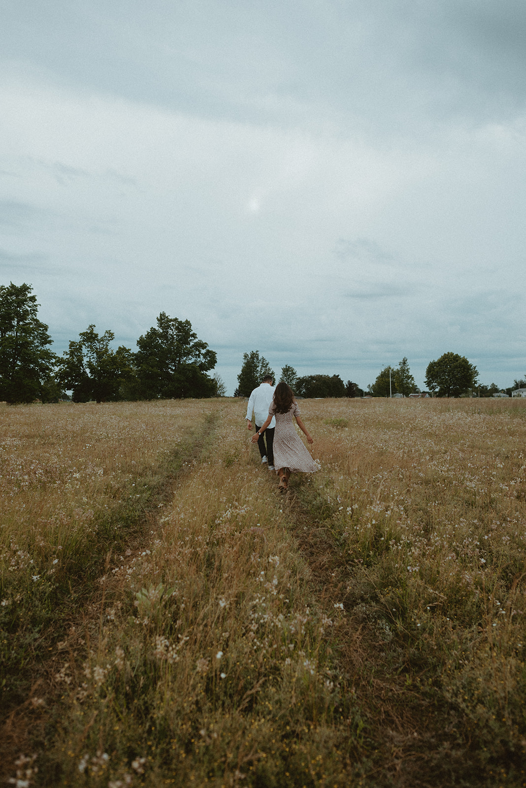 windy engagement shoot in field