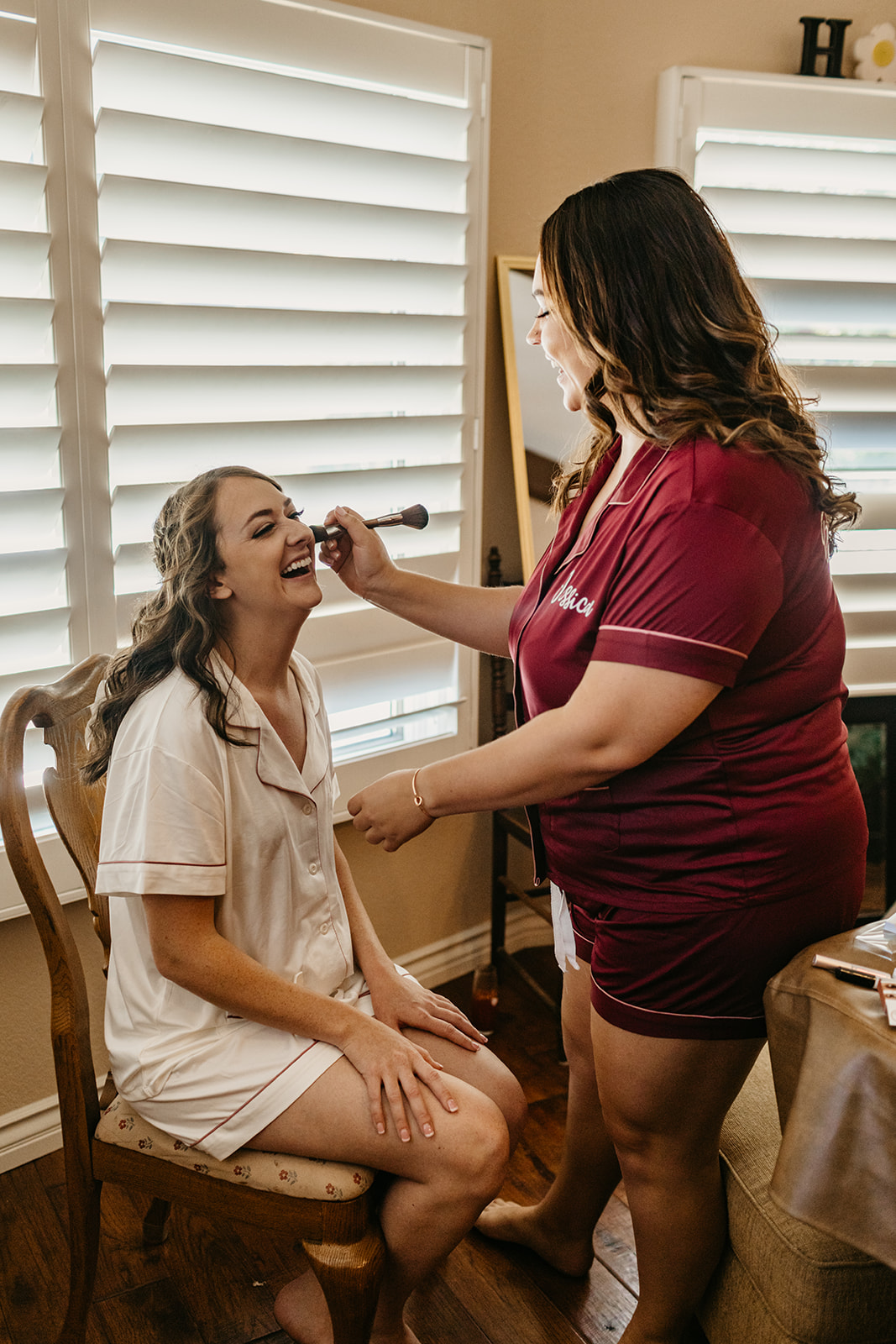 Bride gets hair and make up done by her sister