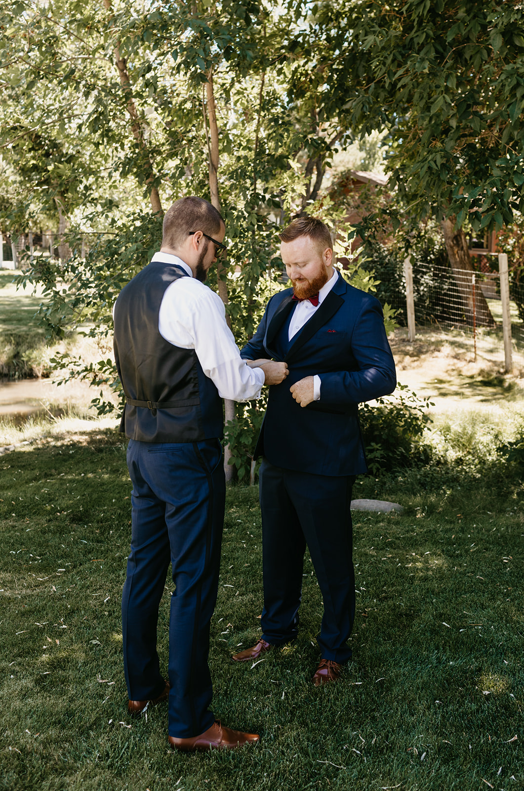 Grooms brother helps groom get ready for the wedding day