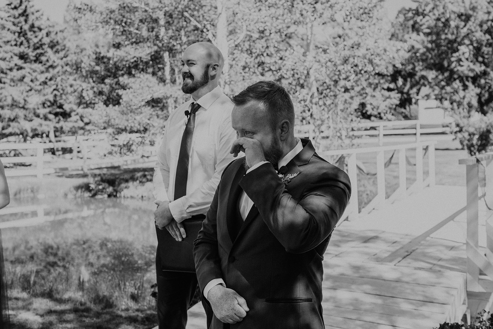 Groom tearing up as he sees his fiance walk down the aisle