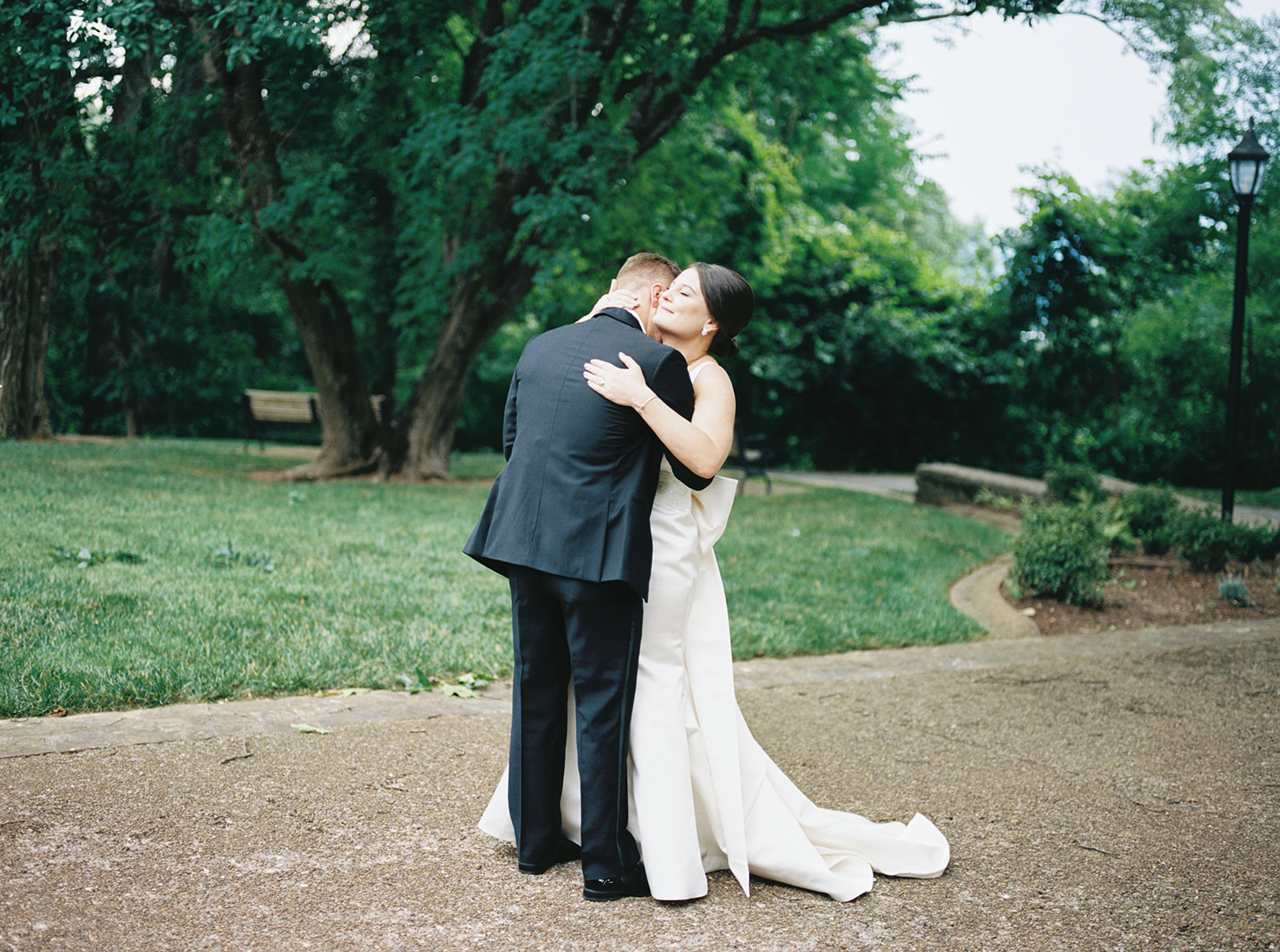 The bride and groom embrace after their first look at Burritt on the Mountain in Huntsville, Alabama