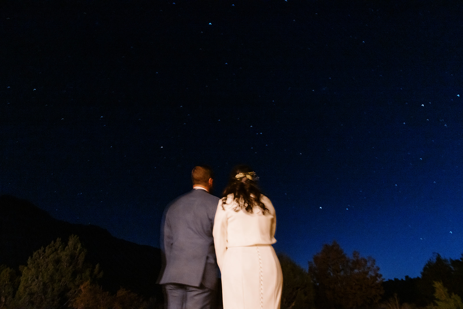 Couple under the stars after their wedding on BLM land outside of Zion National Park