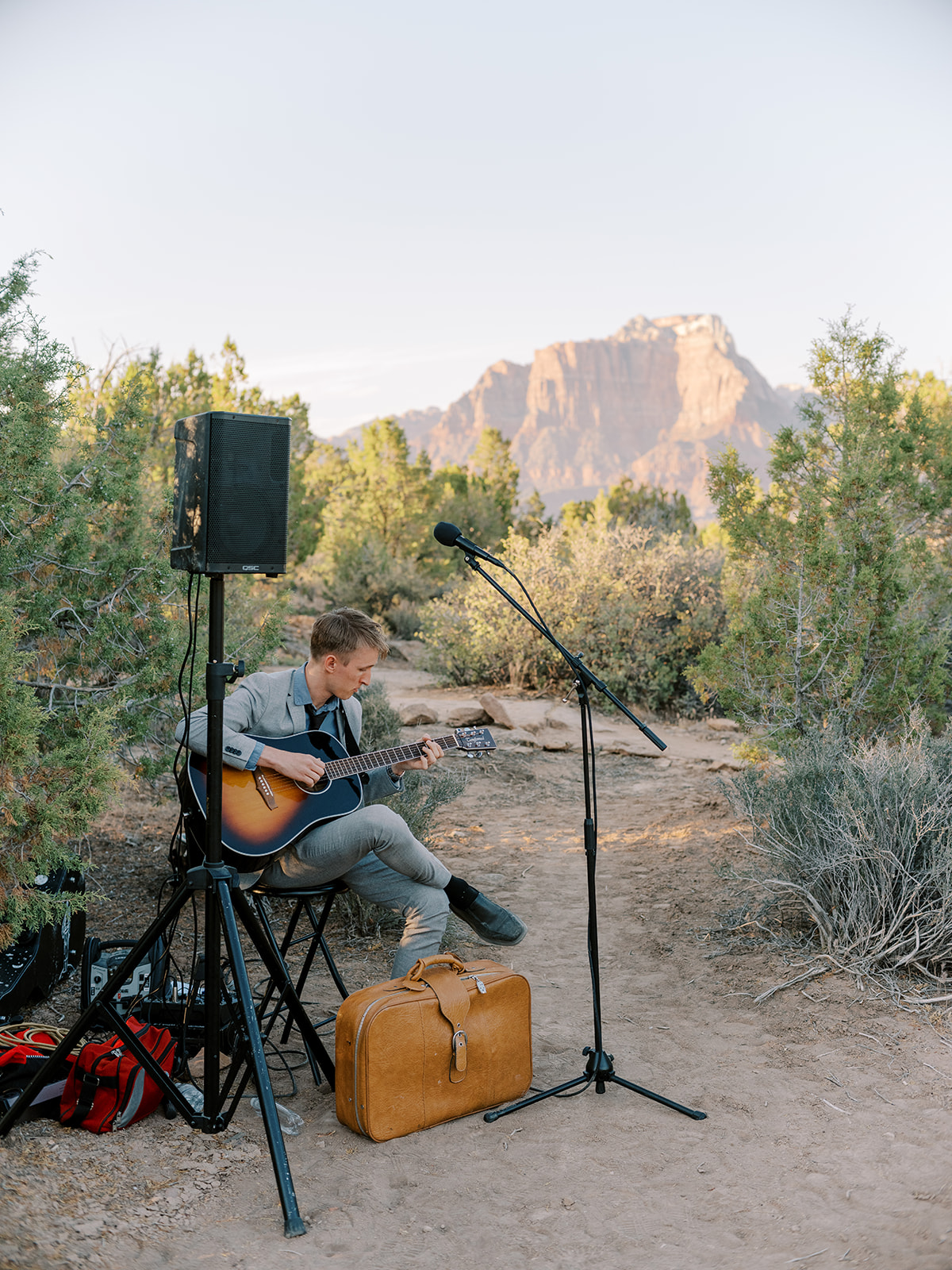 Private musician plays for the wedding guests after the wedding on BLM land outside of Zion National Park