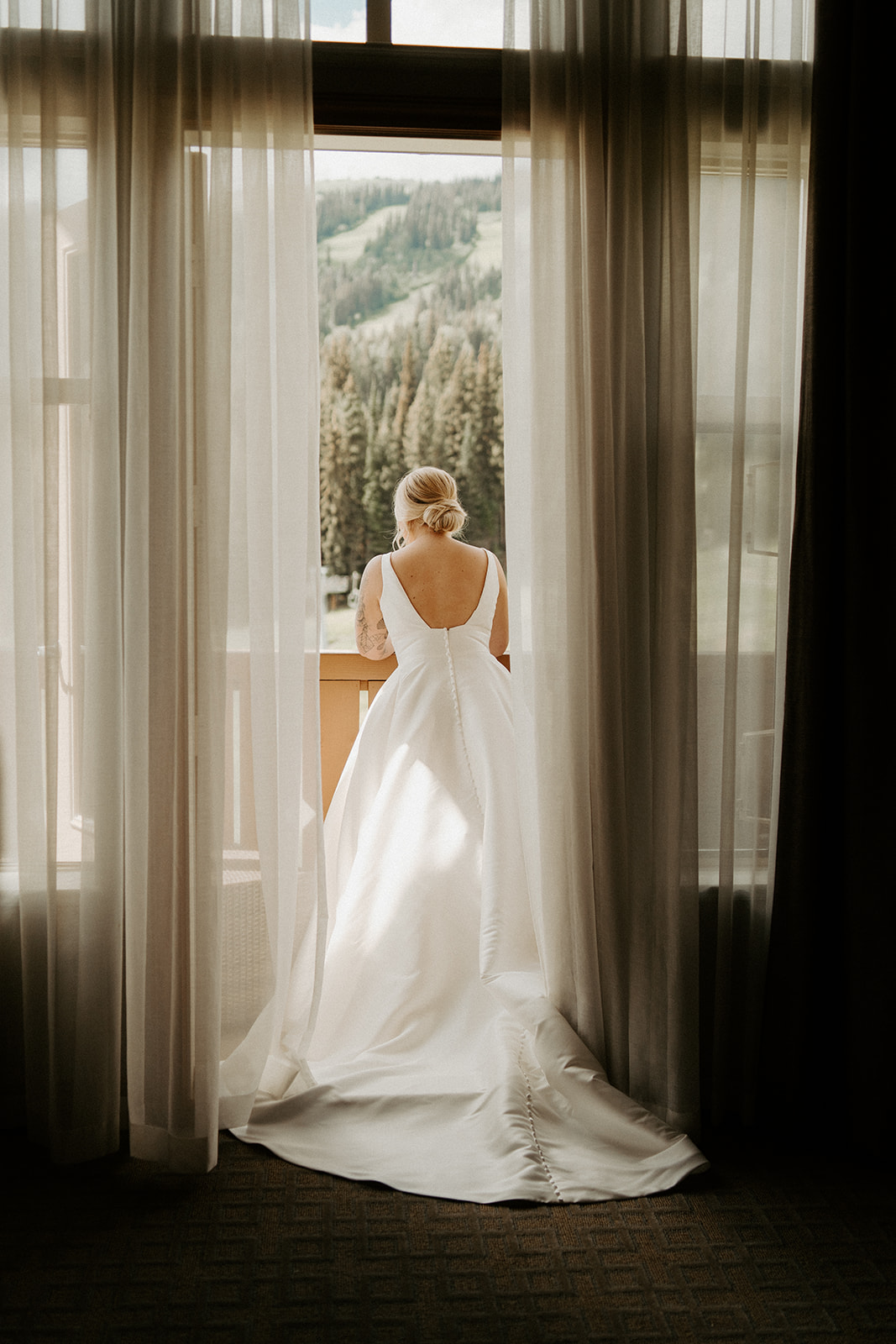 Bride looking off into the mountains