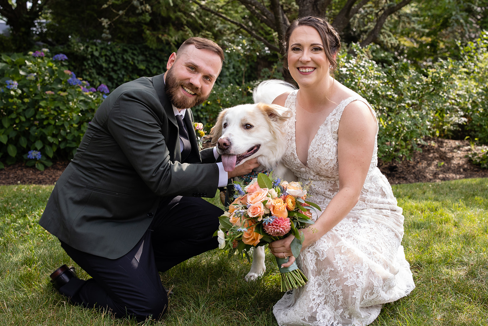 couple poses with their dog at their wedding at the red lion inn