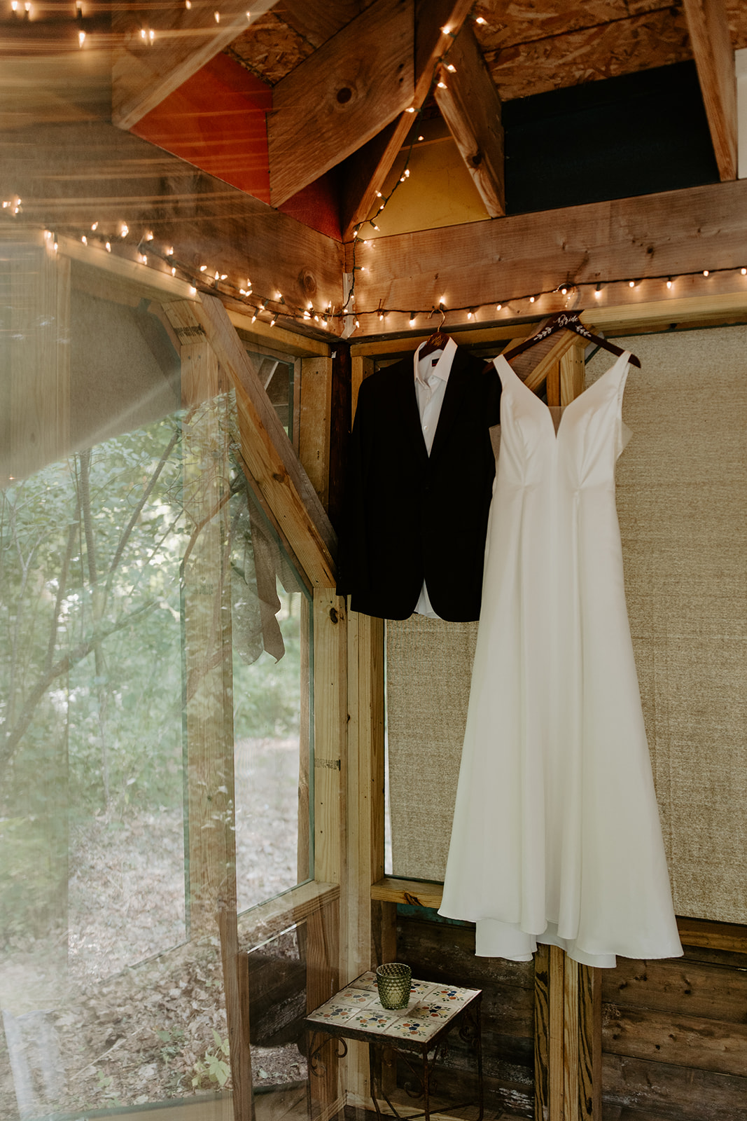 wedding dress and suit hanging photo for intimate traverse city wedding