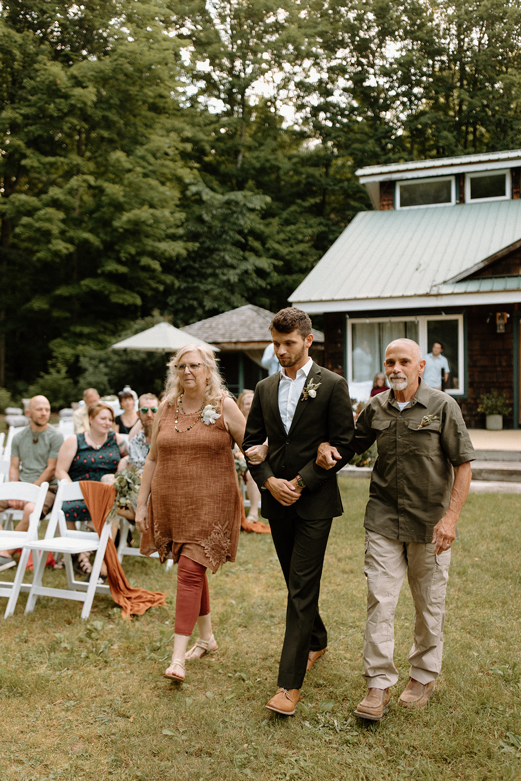 outdoor ceremony for summer backyard wedding in traverse city michigan