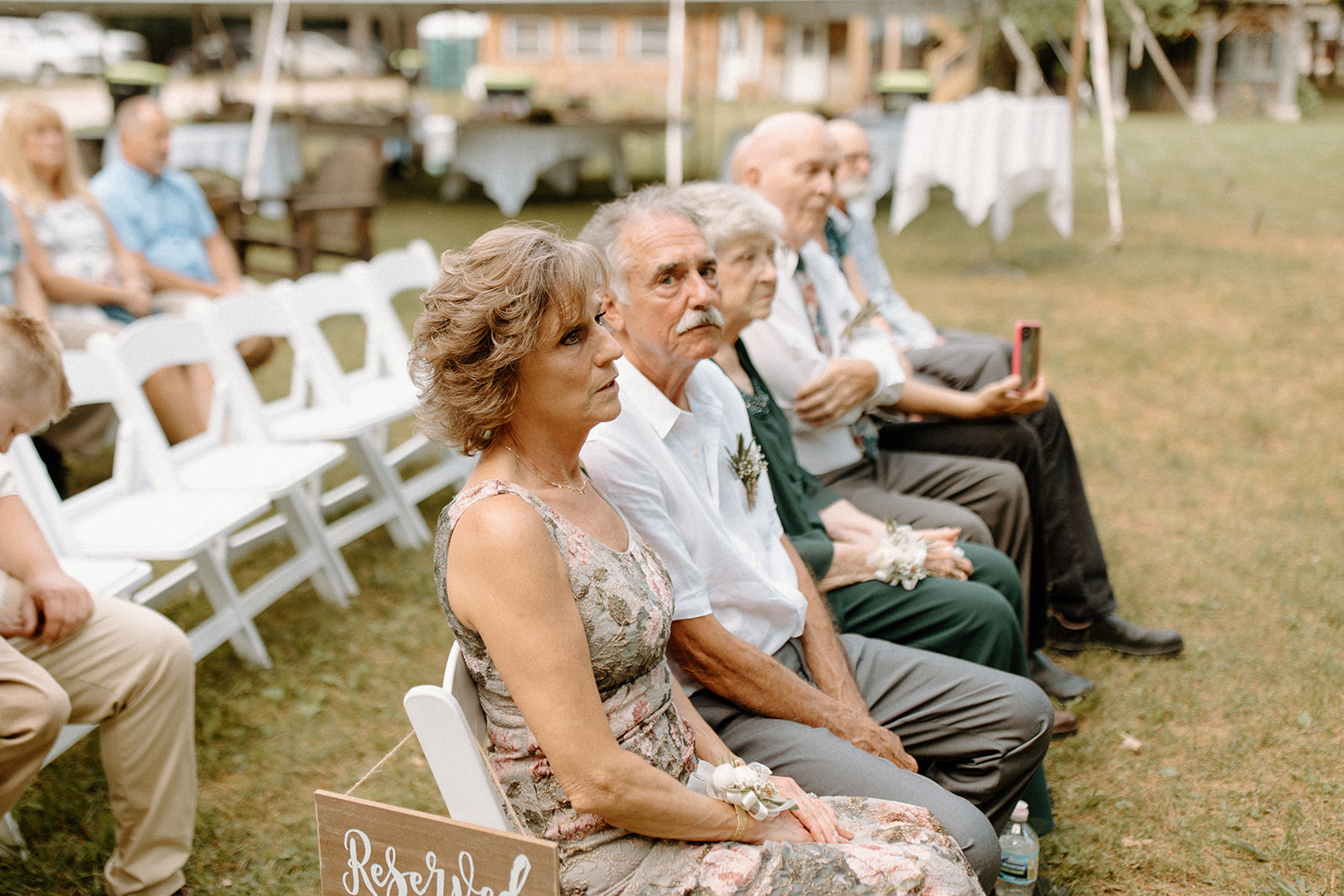 outdoor ceremony for summer backyard wedding in traverse city michigan