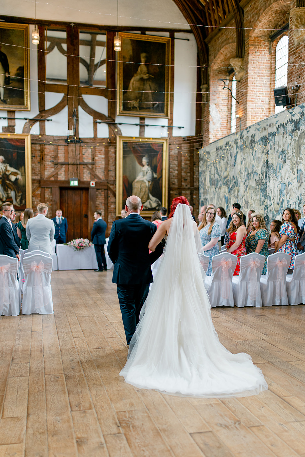 A wedding blessing in front of family and friends at Hatfield House.