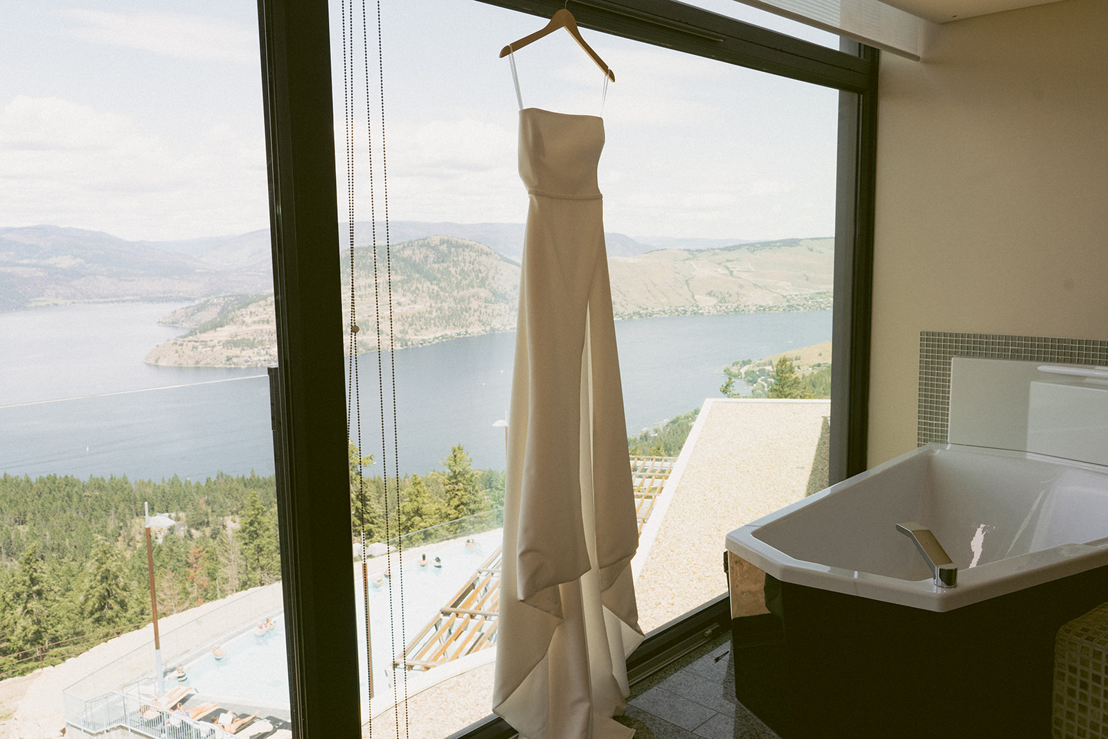 Gorgeous Silk Wedding Dress hanging from the window
