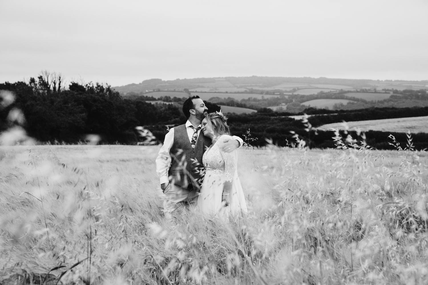 bride and groom portraits in a field at dusk