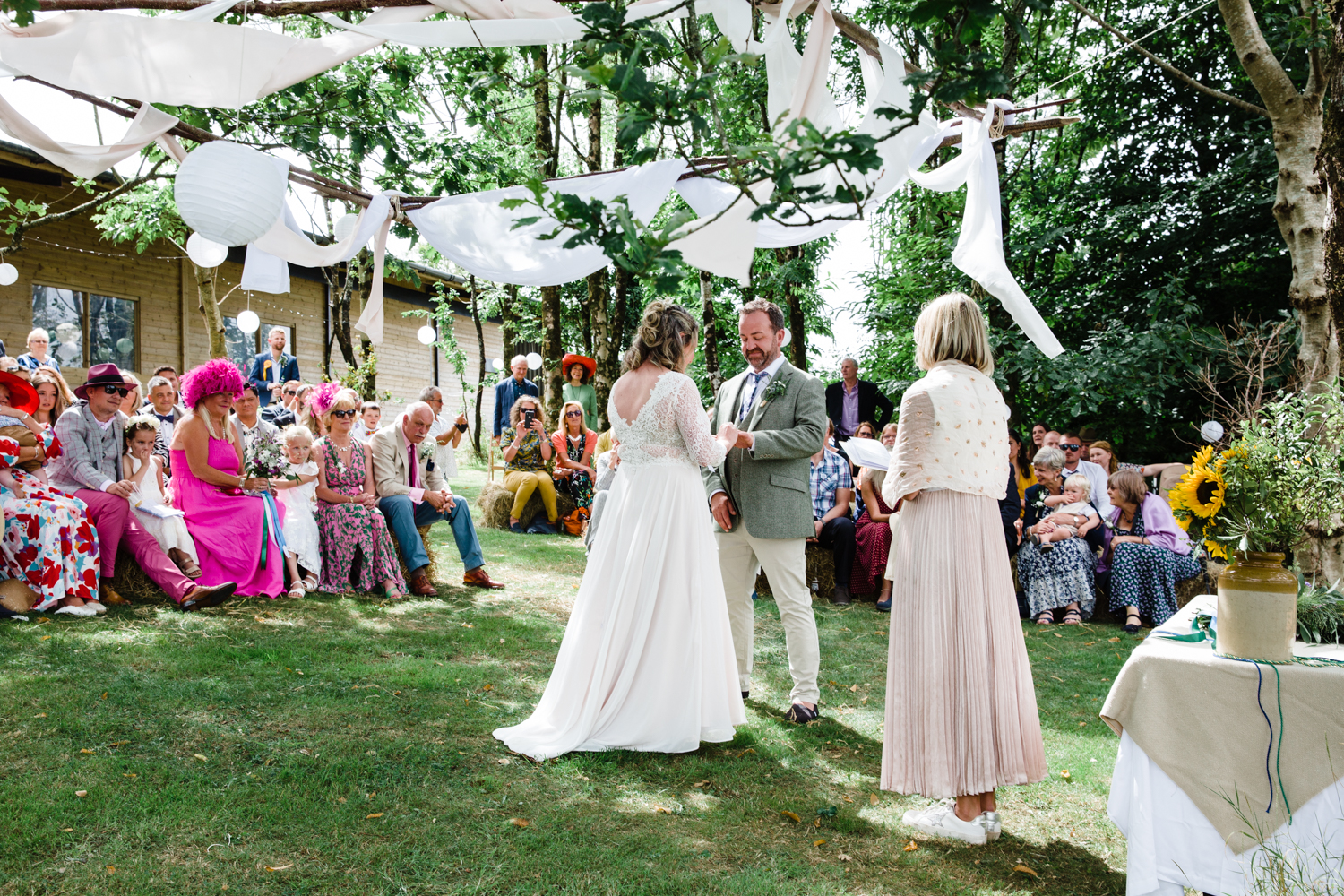 humanist wedding ceremony taking place in a woodland setting at Holsome Park, Devon