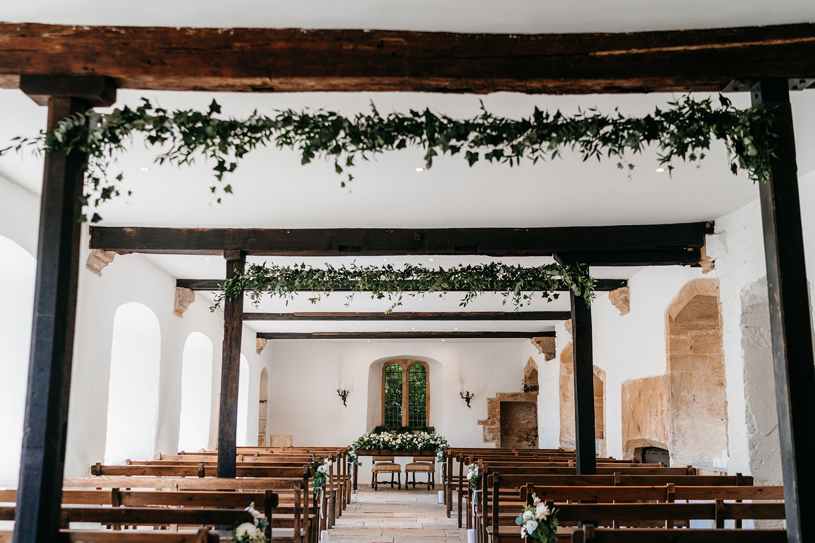 The ceremony room covered in beautiful greenery and florals