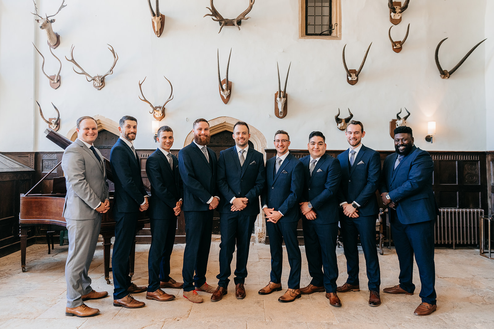 The groomsmen in the great hall before the wedding ceremony