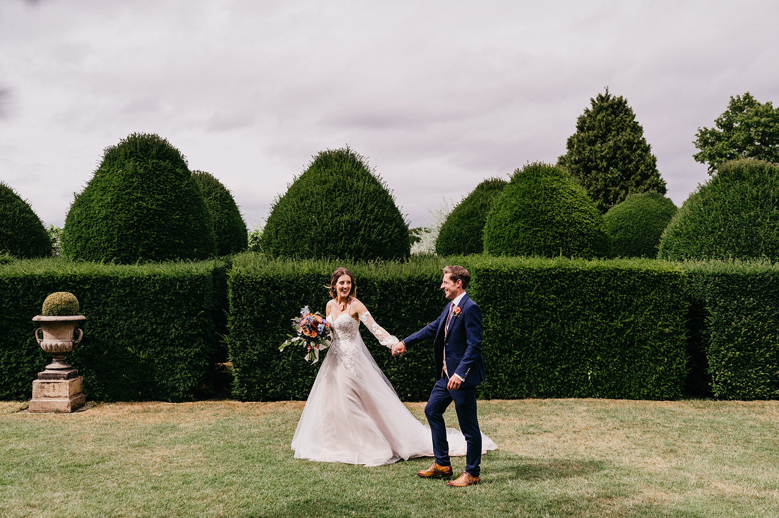 A bride and groom in Birtsmorton Court landscaped Gardens