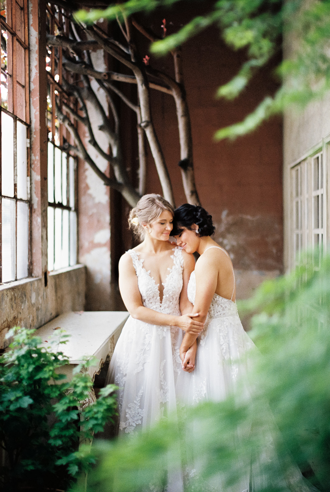 two brides hug each other at The Ruins wedding venue