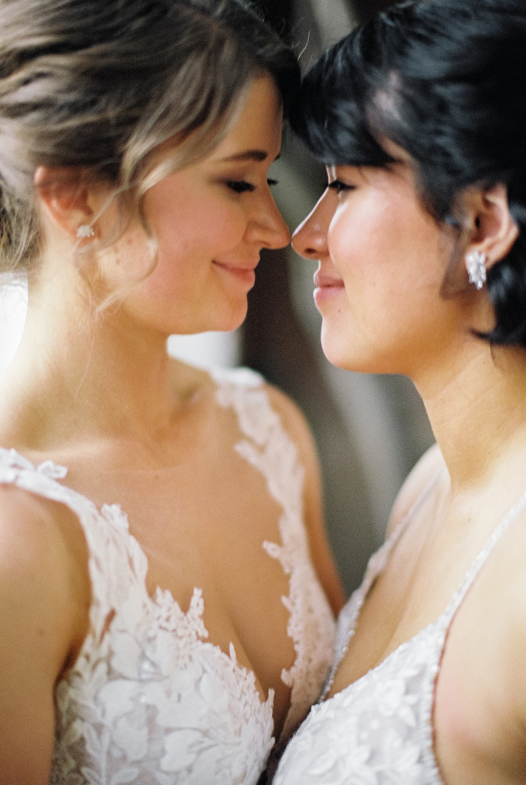 two brides snuggle faces