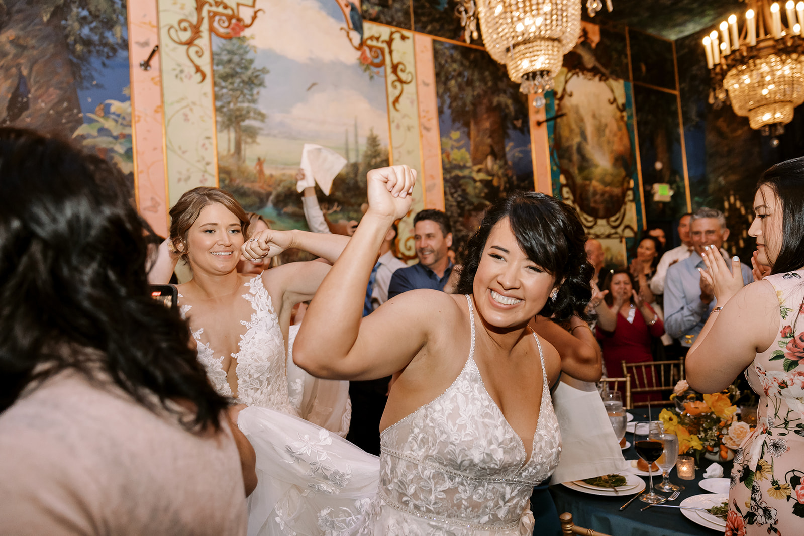 bride fist pumps the air during dance