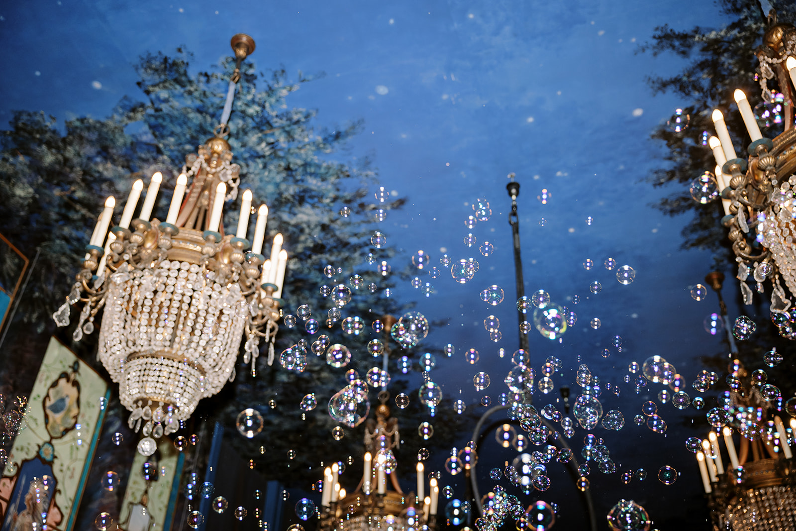 ceiling at the ruins wedding venue with crystal chandeliers and bubbles floating up
