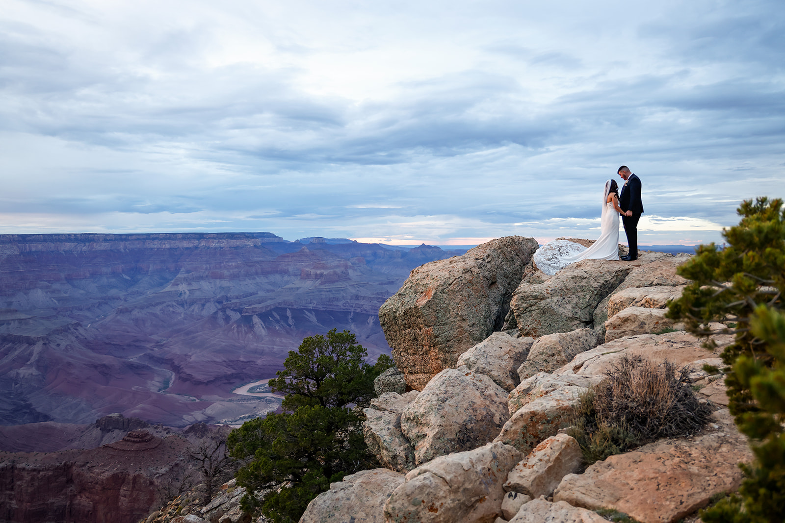 Grand Canyon Romantic Wedding. Bride and groom landscape portrait. Luxury Arizona wedding photographers.
